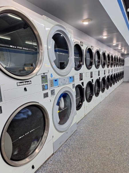 Wall of dryers at Lapeer Laundry